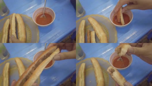 越南海防:亚洲面包卷，夹肉酱的三明治高清在线视频素材下载