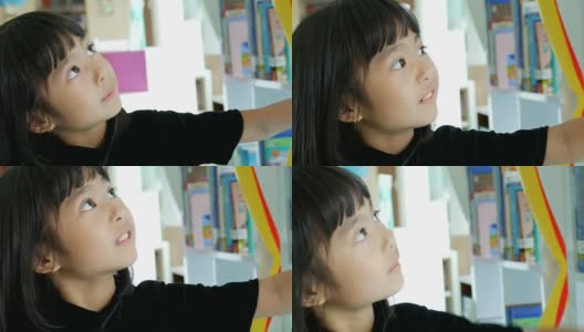 亚洲女孩在图书馆看书高清在线视频素材下载