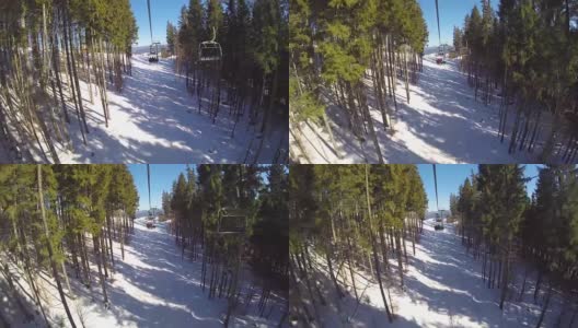 滑雪缆车把人们抬上山。滑雪者从多雪的山上下来。人们在滑雪，高山上的云杉，阳光灿烂的日子高清在线视频素材下载