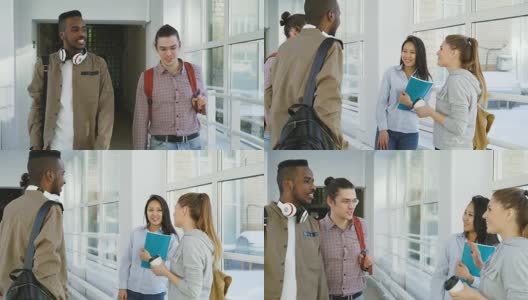 两个英俊的男学生走在长长的白色玻璃走廊在大学遇见他们的女同学说你好站和积极交谈高清在线视频素材下载