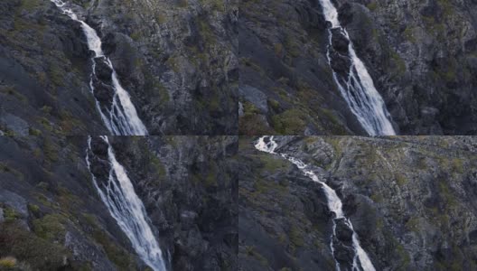 高清瀑布在挪威悬崖的慢动作，Pan Down空中视角高清在线视频素材下载