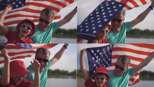 小男孩和他的父亲举着美国国旗高清在线视频素材下载