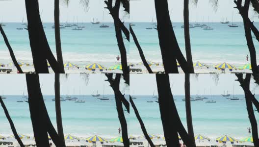 国王杯赛舟会。泰国普吉岛卡塔海滩。游艇、海滩和海上的遮阳板。高清在线视频素材下载
