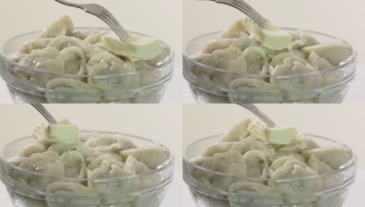 一碗自制的黄油水饺。传统的俄罗斯菜pelmeni高清在线视频素材下载