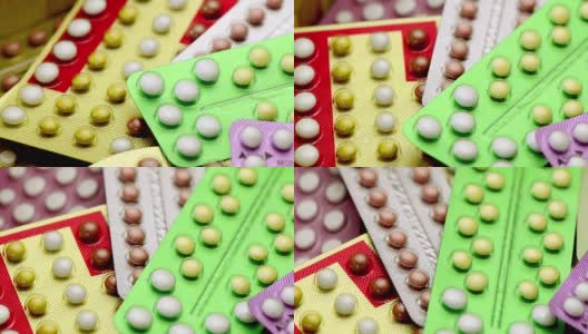 口服避孕药在药房柜台与彩色药丸条的背景。高清在线视频素材下载