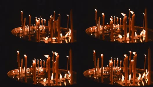 在圣墓教堂，一些蜡烛随着火焰被风移动的视频。圣墓教堂位于以色列耶路撒冷老城的基督教区高清在线视频素材下载