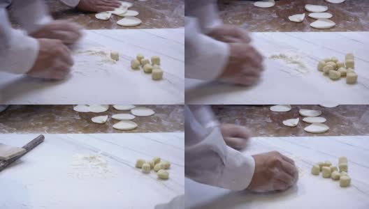 4K，团队厨师擀开面团，然后填上肉，做成饺子高清在线视频素材下载