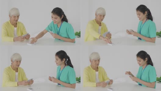 亚洲年轻女性护士或家庭健康助理与老夫妇打牌在客厅的桌子在家里的家庭保健概念。高清在线视频素材下载
