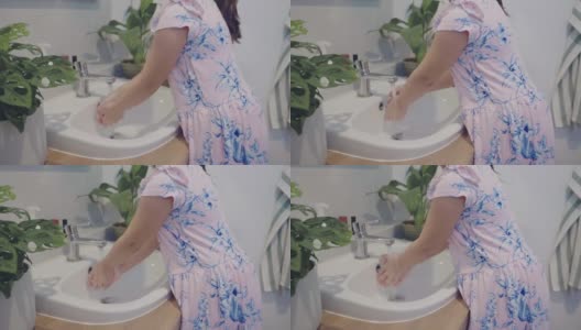 小女孩在洗手。高清在线视频素材下载