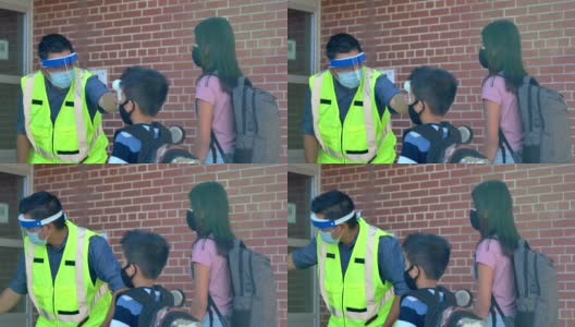 男老师在学校门口做体温检查高清在线视频素材下载