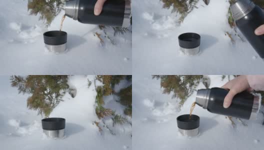 雪地上放着热水瓶。高清在线视频素材下载