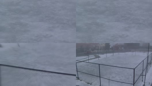 空荡荡的雪地覆盖着足球场。缩小。高清在线视频素材下载