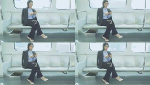 女职工在火车上使用手机高清在线视频素材下载