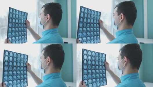 医生正在看脑部的核磁共振扫描高清在线视频素材下载
