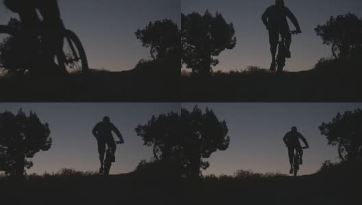 一个男人骑着山地车上山在沙漠剪影高清在线视频素材下载