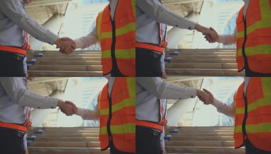 两名保安人员或员工在工作场所成功工作后握手约定。缓慢的运动。高清在线视频素材下载