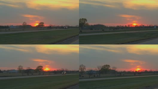观点:在日出时，开车经过农田，穿过风景如画的乡村高清在线视频素材下载