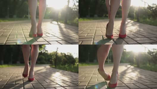 穿着红色高跟鞋的女人在街上扭伤了脚高清在线视频素材下载
