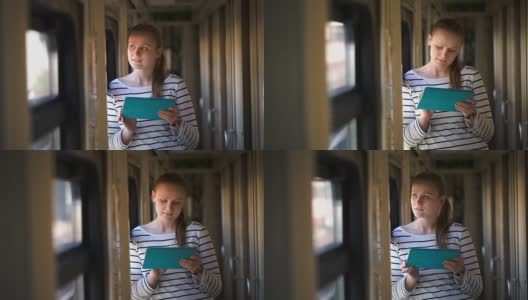 火车上一个年轻女子拿着垫子站在窗边高清在线视频素材下载