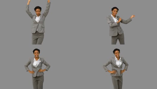 快乐的女商人在灰色的屏幕上跳舞高清在线视频素材下载