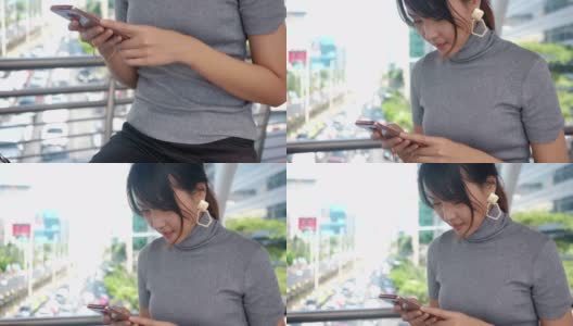 亚洲的年轻商人正在使用智能手机高清在线视频素材下载