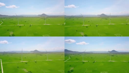 阳光山谷与运行的风力发电站对抗蓝天高清在线视频素材下载