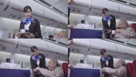 空中小姐在飞机上提供食物和饮料高清在线视频素材下载