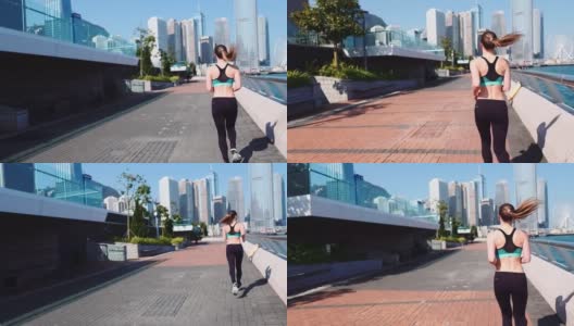 缓慢的运动。年轻的健身女性跑步在香港城市。高清在线视频素材下载