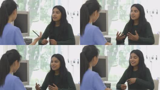 年轻的印度妇女向她的医生咨询高清在线视频素材下载