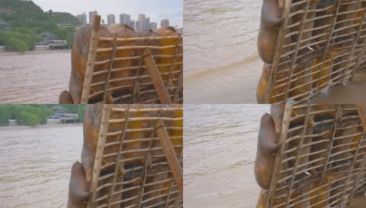 中国甘肃兰州黄河旁的羊皮筏子高清在线视频素材下载