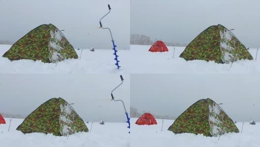 冬季在西伯利亚捕鱼-渔民的帐篷在冰Ob水库在新西伯利亚，俄罗斯高清在线视频素材下载