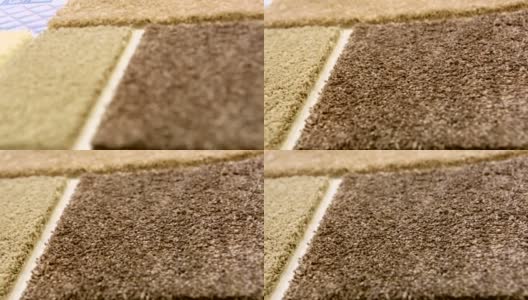 在一个室内设计商店的棕色地毯例子的特写。高清在线视频素材下载