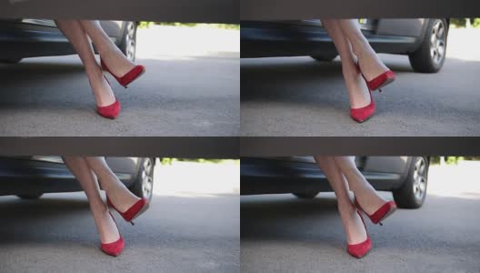 穿着红色高跟鞋坐在车里的女人高清在线视频素材下载