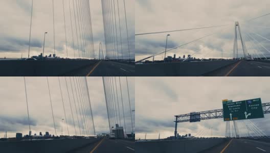 在密苏里州圣路易斯和密苏里/伊利诺斯州边界70号州际公路上的Stan Musial Veterans Memorial Bridge(悬索桥)西行时穿越密西西比河的车辆视角高清在线视频素材下载