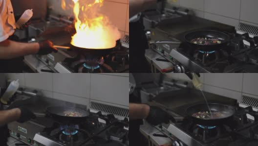 厨师在厨房用煎锅做饭高清在线视频素材下载