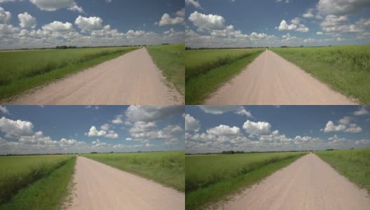 夏天在农田之间的砾石路高清在线视频素材下载