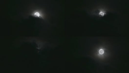 云层在满月中移动，大气看起来神秘而可怕。4 k的视频。高清在线视频素材下载