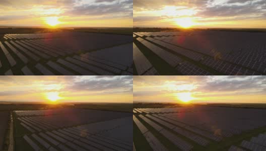 鸟瞰图，大型可持续发电厂，在日落时，一排排太阳能光伏板用于生产清洁的生态电能。零排放的可再生电力高清在线视频素材下载