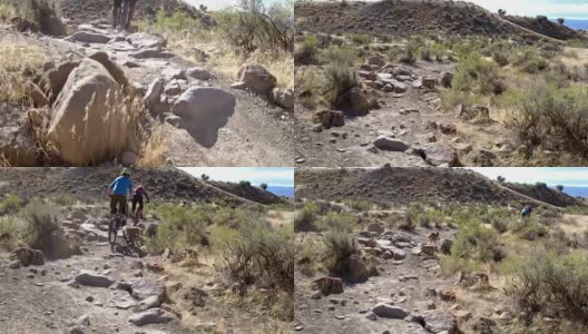 三名山地自行车手和一只狗在科罗拉多州Fruita的18号公路上骑过岩石高清在线视频素材下载