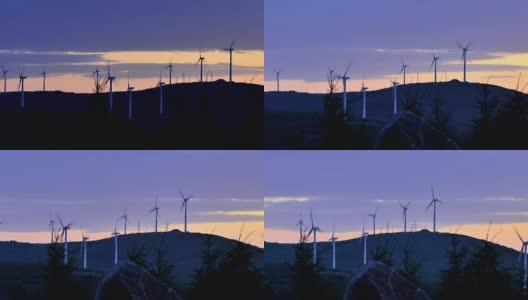 4K:戏剧性天空中日出时的风力涡轮机高清在线视频素材下载