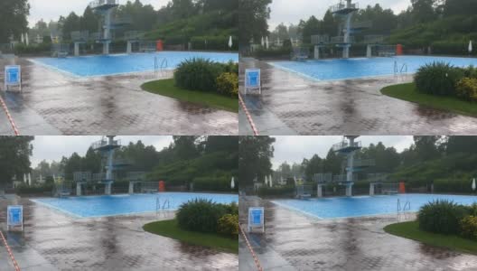 室外游泳池里的夏日大雨高清在线视频素材下载