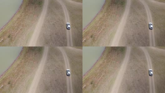 4K鸟瞰图跟踪白色汽车驾驶高清在线视频素材下载
