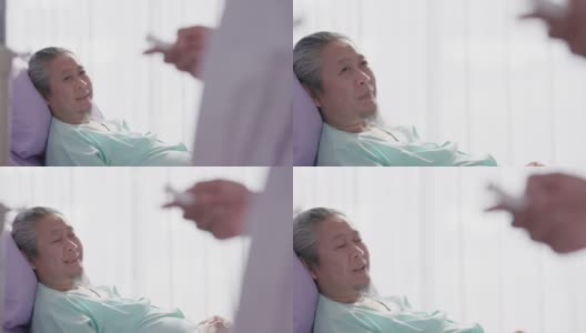 在医院的病房里，一位亚洲老年男性病人躺在床上。高清在线视频素材下载