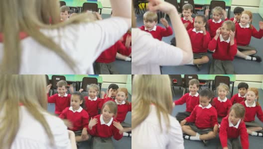 小学生模仿老师唱歌的动作高清在线视频素材下载