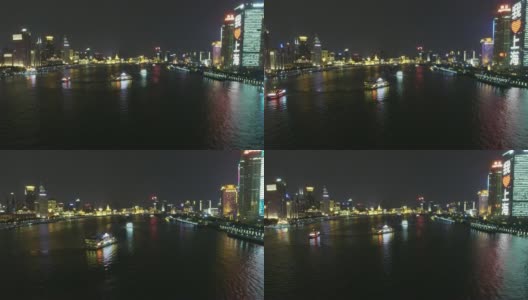 航拍黄浦江上的船只夜间航行/中国上海高清在线视频素材下载