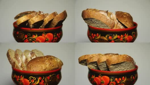 新鲜的面包在盘中，与图- khokhloma，圆形运动。高清在线视频素材下载