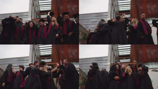 各种各样的学生把他们的毕业帽抛向空中，庆祝他们刚刚毕业，拥抱和微笑高清在线视频素材下载