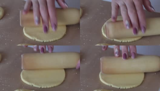 一个女人在擀玉米面面团。准备无酵饼。特写镜头高清在线视频素材下载