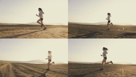 强壮年轻的亚洲女运动员跑步运动员速度跑训练锻炼在海滩上最后一个美丽的日落。医疗保健的生活方式的概念。高清在线视频素材下载