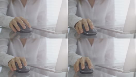 年轻的商业女性使用电脑鼠标高清在线视频素材下载